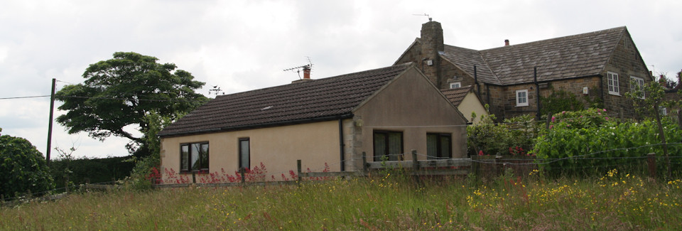 Side view of Elm Croft Cottage, Hollins from the adjacent meadow