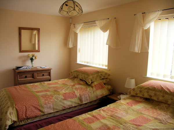 The bedroom configured as two singles (1)
