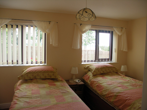 The bedroom configured as two singles (2)